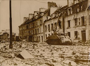 An American tank stands in a road in Cherbourg, Normandy, 1944. Artist: Unknown
