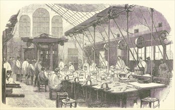 Silversmiths at work at the Christophle Flatware Factory in Paris, pub. 1875. Creator: Edmond Morin (1824 - 1882).