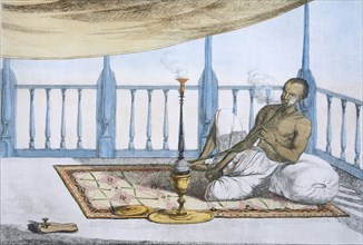 Man smoking a hookah of hashish or opium, pub. 1808-12. Creator: Franz Balthazar Solvyns (1760-1824).