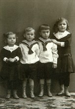 Portrait of four children, 1910s. Artist: Georgi Vasilievich Trunov