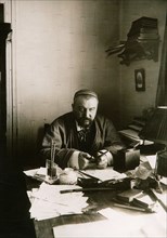 Alexander Kuprin, Russian author, at his desk, Gatchina, Russia, early 20th century.  Artist: Karl Karlovich Bulla