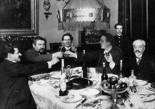 Russian author Alexander Kuprin with friends in Paris, 1930s.  Artist: Anon