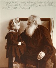 Russian author Leo Tolstoy with his granddaughter Tatiana, Yasnaya Polyana, Russia, c1910.  Artist: Vladimir Grigorievich Chertkov