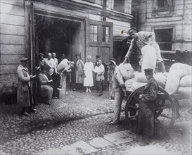 Unloading food, the House of Scientists, Petrograd, Russia, c1920-c1924(?). Artist: Unknown