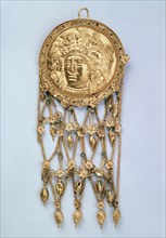 'Pendant with Head of Athena Parthenos', early 4th century BC. Artist: Unknown