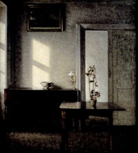 Interior with potted plant on card table, 1910-1911. Artist: Hammershøi, Vilhelm (1864-1916)