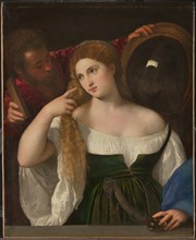 Young Woman at her Toilette, ca 1515. Artist: Titian (1488-1576)