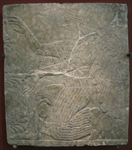 Winged deity by the sacred tree. Relief from the palace of Ashurnasirpal II at Kalhu, Nimrud, 9th century BC. Artist: Assyrian Art