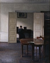 Interior with Ida Playing the Piano. Artist: Hammershøi, Vilhelm (1864-1916)