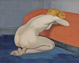 Naked woman kneeling in front of a red couch, 1915. Artist: Vallotton, Felix Edouard (1865-1925)