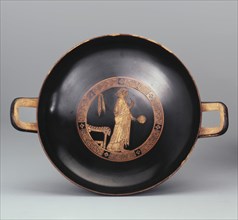 Kylix. A Woman with a Mirror. Attic pottery.