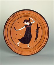 Plate with a dancing girl. Attic pottery.