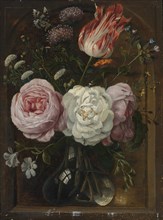 Flower still life with a tulip and roses in a glass vase.