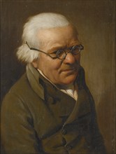 Portrait of a man wearing glasses.