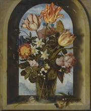tulips, moss-roses, lily-of-the-valley and other flowers in a glass beaker set in an arched stone wi