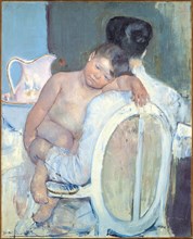 Woman Sitting with a Child in Her Arms.