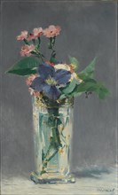 Carnations and clematis in a crystal vase, c. 1882.