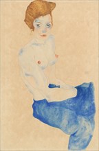 Sitting young woman, half nude with blue skirt, 1911.