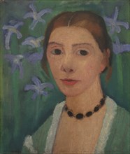 Self portrait in front of green background with blue irises, c. 1905.