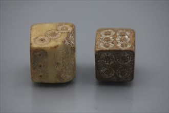 A pair of Roman dice made from carved bone, 1st century BC.