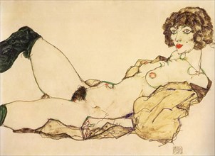 Lying nude with green stockings, 1917.