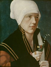 Portrait of a woman holding a Lily-of-the-Valley and a pansy, before 1520.
