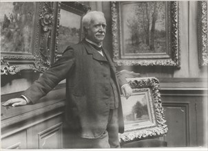 Portrait of Paul Durand-Ruel (1831-1922) in his gallery, c. 1910.