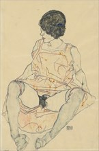 Seated woman with pushed up dress, 1914.