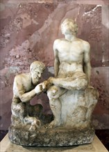 Pan and satyr, Pan removing a splinter from a satyr's foot. Artist: Unknown