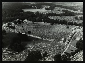 Aerial view of crowds at the Knebworth pop festival, 1986. Artist: Denis Williams
