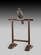 Figurine of hawk on a perch, c1890. Artists: Unknown, Jomi Eisuke.