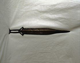 Sword of three parts barb, carp's tongue shaped blade, from Palma del Rio (Cordoba).