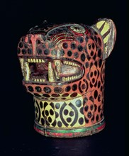 Kero or carved wood vase, jaguar head shaped, in polychromed wood.