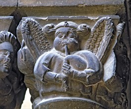 Capital of one of the Gothic galleries of the cloister built between (1387 - 1401) representing a?