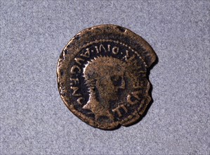 Roman coin from the first half of the first century AC, with a head facing right and the legend '?