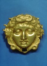 Head of the Gorgon Medusa in embossing gold, piece from the royal tomb at Vergina (350 BC).