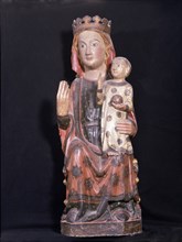 'Mother of God', polychromed wood sculpture. Virgin seated, with his right hand raised while hol?