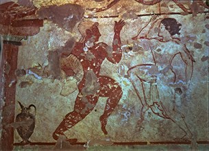 Burial chamber of the necropolis of Tarquinia, mural painting representing two dancers.