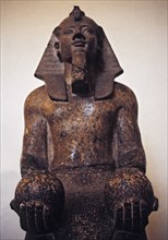 Statue of Pharaoh Amenophis II or Amenhotep, of the XVIII dynasty, making an offering with two gl?