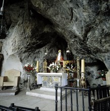 Interior of the Holy Cave of Covadonga with the image of the Virgin.
