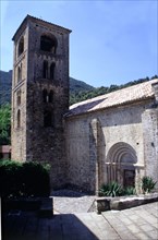 View of the front door and the bell tower of the Church of Sant Cristòfol in Beget.