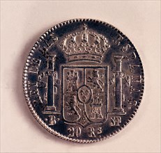 Back of a coin of 20-reales in silver, Ferdinand VII. Mint: Barcelona, 1823.