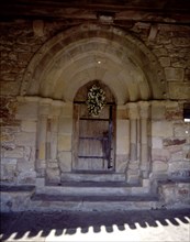View of the door of the hermitage of San Pelayo, both the door and windows are pointed, the bell ?