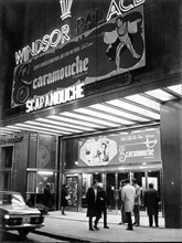 Façade of old cinema Windsor in Barcelona with neon signs advertising the film Scaromouche, 1952.