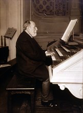 Camille Saint-Saens (1835 - 1921), French composer, photography playing the organ.