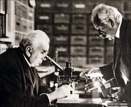 Louis and Auguste Lumière (1864-1948 and 1862-1954), French chemists and biologists in their labo?