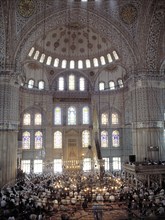 Interior view of the Blue Mosque in Istanbul during Friday prayers.