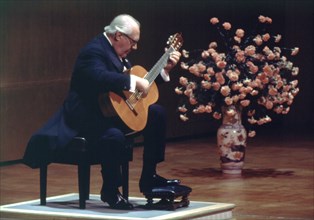 Andrés Segovia (1894-1987), Spanish concert guitar during a performance in Madrid.