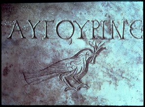 Gravestone with the figure of a dove or a sparrow in the Catacombs of San Calixtus.