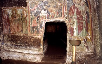 Detail of the interior of the sanctum of Mitreo and the mural paintings subsequently painted on t?